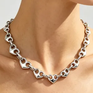 Macro detail of high-quality stainless steel hollow heart-shaped chain choker necklace