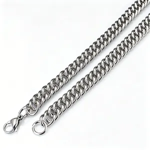 Close-up of double-woven silver stainless steel Cuban link chain with lobster clasp