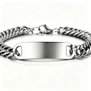 Close-up of a polished stainless steel Cuban link bracelet with a customizable blank ID plate.