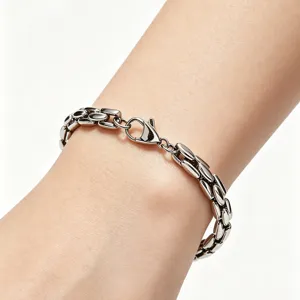 High-quality detail view of a polished titanium steel bamboo tank chain bracelet on a wrist