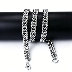 Detail of a double-woven stainless steel thick Cuban link chain with a lobster clasp.