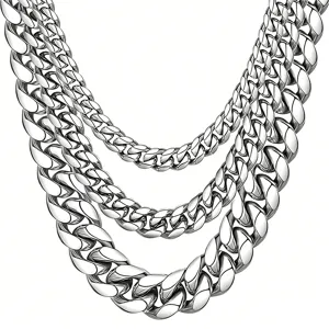 Detailed view of layered silver stainless steel Cuban link chains in various sizes