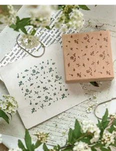 Vintage beechwood stamp with delicate floral patterns for DIY creative journal decoration.