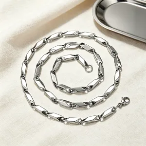Detailed view of a polished stainless steel necklace with geometric rhombus links