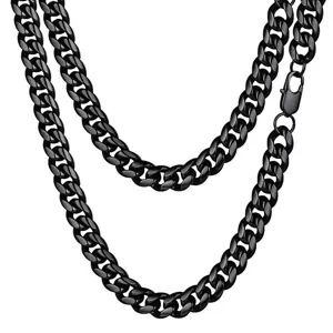 Close-up of heavy black stainless steel Cuban link necklace with lobster clasp detail