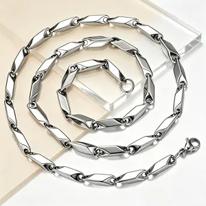 Detailed view of polished stainless steel diamond-shaped link chain necklace for men.
