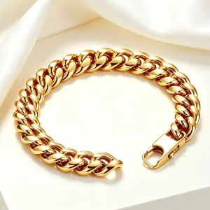 Detailed close-up of heavy polished 18K gold-plated stainless steel Cuban link bracelet