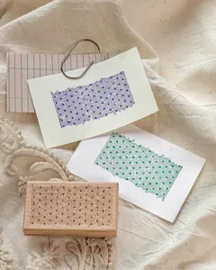 Detailed macro view of beech wood stamp featuring a delicate polka dot lace pattern