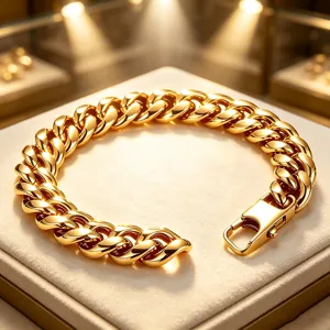 Detailed view of polished 18K gold plated stainless steel Cuban link bracelet for men.