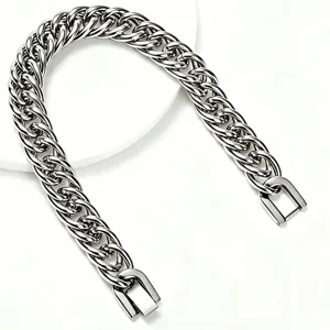 Detailed macro view of high-polished stainless steel Cuban link chain with square clasp