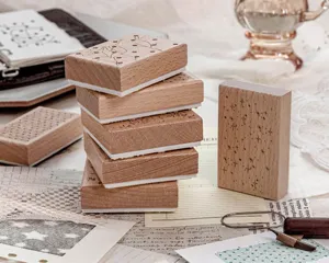 Detailed close-up view of decorative beech wood stamps for stationery and journaling crafts