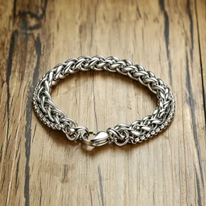 Detailed macro view of silver double-layered stainless steel wheat and box chain bracelet