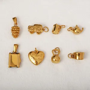 Detail view of various 18k gold-plated stainless steel charms for DIY jewelry