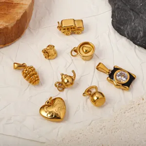 Gold plated stainless steel charms set featuring bus, kettlebell, heart, and camera shapes.