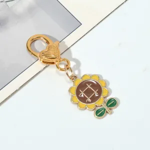Macro view of detailed sunflower pendant on gold-plated heart clasp