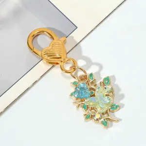 Exquisite flower and butterfly keychain with gold-plated heart-shaped lobster clasp detail