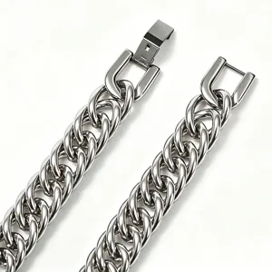 Close-up macro shot of polished stainless steel thick Cuban chain with square folding clasp