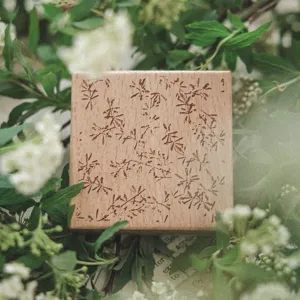Artistic beechwood stamp with intricate botanical leaf pattern for DIY scrapbooking