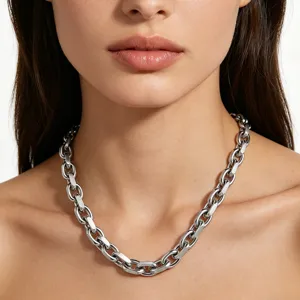Detailed close-up of a high-polished stainless steel chunky oval chain necklace on neck