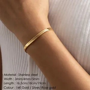 Macro view of 14K gold-plated stainless steel snake chain bracelet worn on a wrist.