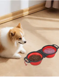 Portable collapsible double pet bowl with red silicone design for outdoor dog cat feeding.