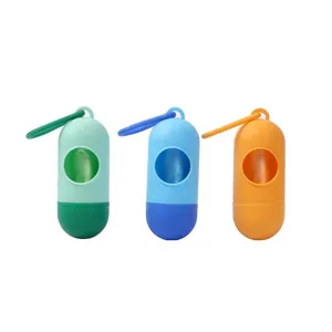 Dispensador portatil de bolsas para excrementos de perro en forma de capsula verde azul naranja