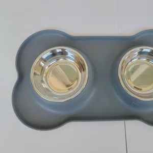 Silicone pet double bowl set with stainless steel feeding bowls and anti-slip bone placemat.