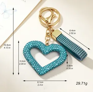 Luxurious teal rhinestone hollow heart keychain bag charm with dimensions and weight