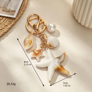 Detailed macro shot of creative ocean theme keychain with seashell and starfish charms for bags