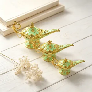 Set of three mint green and gold Aladdin lamps in different sizes for home decor.