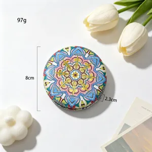 Detailed view of an ethnic patterned folding makeup mirror showing 8cm diameter and 2.3cm height