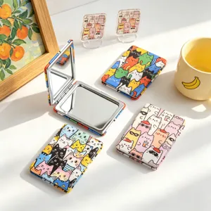 Set of portable folding double-sided makeup mirrors featuring cute cartoon cat illustrations.