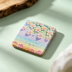Detailed view of portable square makeup mirror featuring oil painting floral beach scene