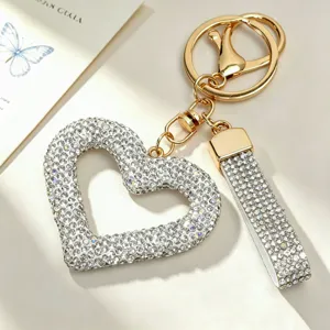 Detailed close-up of a sparkling heart rhinestone keychain with gold-toned hardware