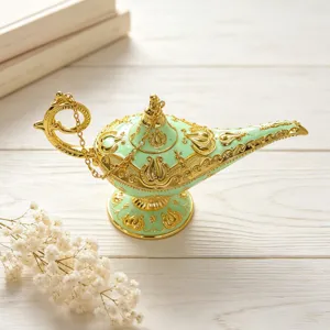 Detailed view of an ornate retro Aladdin lamp in mint green and gold finish