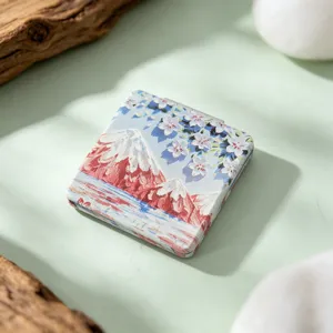 Detailed view of portable square folding makeup mirror featuring Mount Fuji oil painting