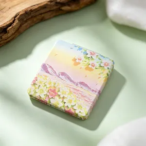 Close-up of portable square folding mirror with artistic oil painting floral design