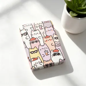 Detailed view of the cute cartoon cat pattern on a portable folding makeup mirror
