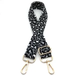 Detailed view of grey leopard print adjustable replacement shoulder strap for bags
