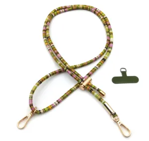 Retro multicolored woven phone strap with gold hardware and green connector tab detail