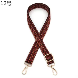 Adjustable woven bag strap with burgundy chevron pattern and gold metal hardware