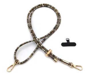 Close-up of vintage beaded phone lanyard with adjustable gold hardware and tether pad