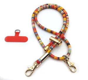 Detailed view of colorful retro woven phone lanyard with gold metal clips