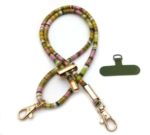 Detailed macro view of a colorful vintage phone lanyard with gold metal clips