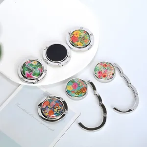 Multiple portable foldable handbag hooks for table edges with colorful floral patterns