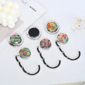 Portable folding table bag hook featuring colorful tropical floral patterns and non-slip back