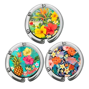 Set of three portable foldable bag hangers for desk featuring vibrant tropical floral designs