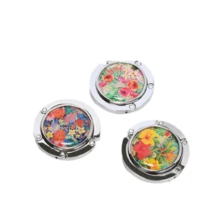 Portable foldable purse hook set with vibrant floral patterns for office desk edges