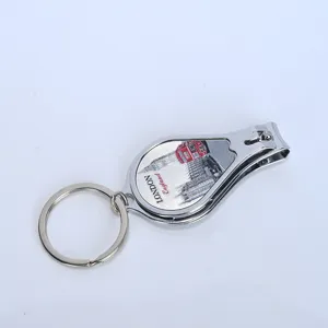 Detail of 3-in-1 metal nail clipper keychain with London souvenir bus design