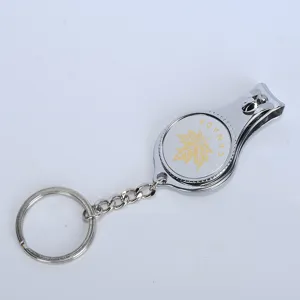 Close-up detail of stainless steel nail clipper featuring a golden Canada maple leaf